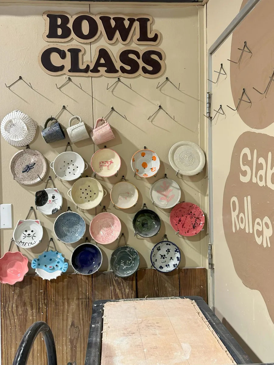 Bowl class wall display of student-made bowls