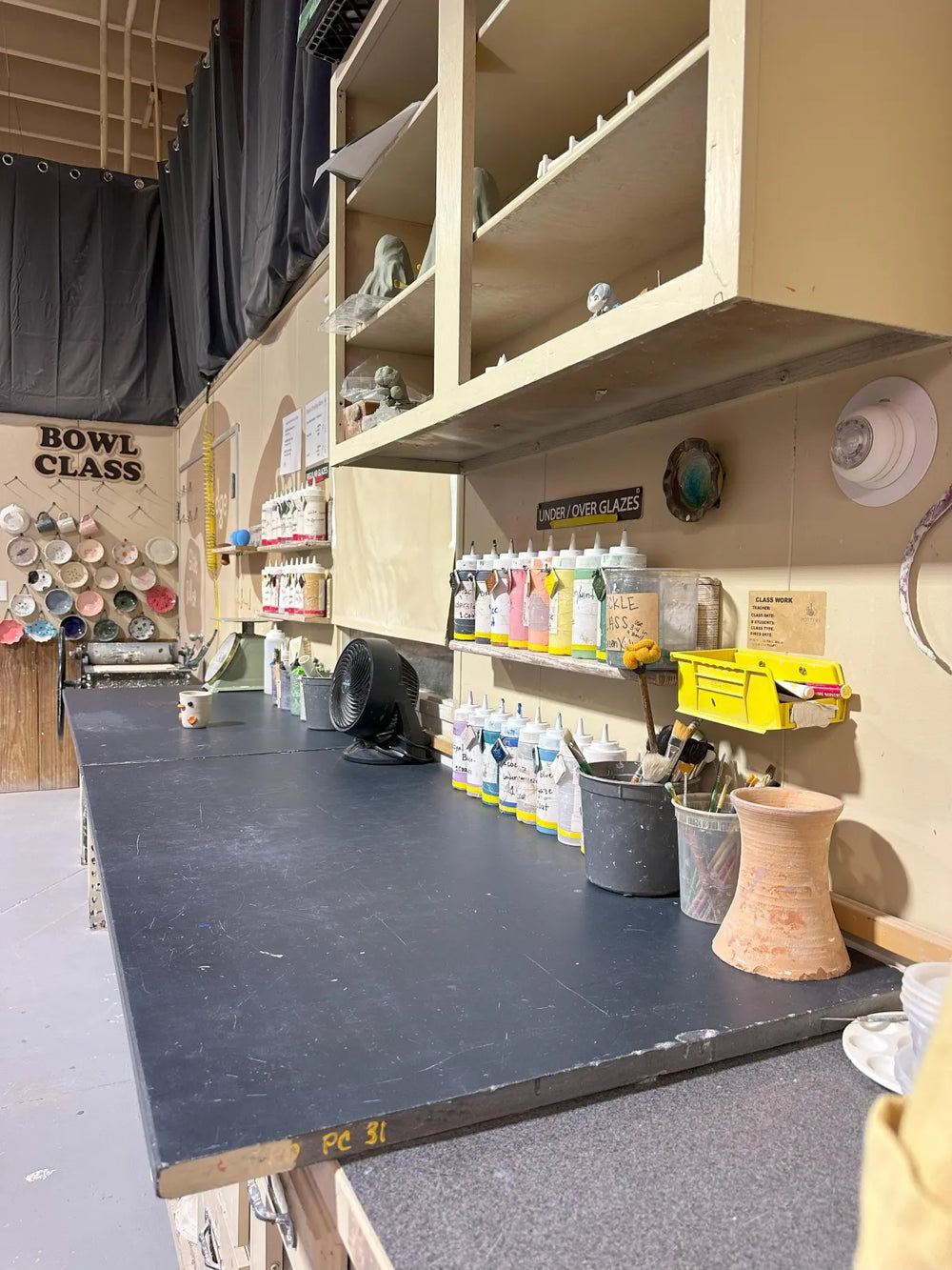 Glaze station with glaze bottles and tools