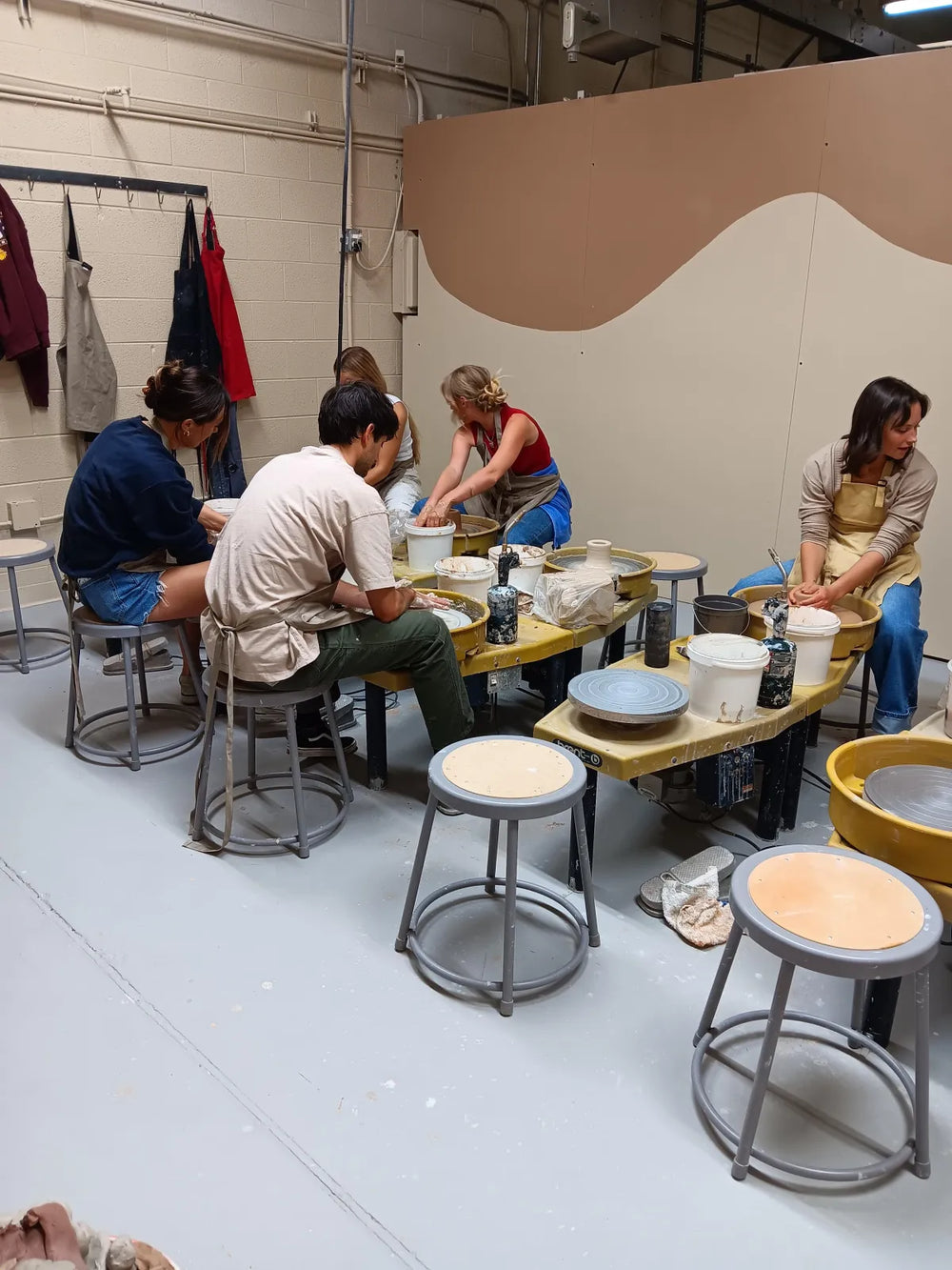 Students working at the studio table